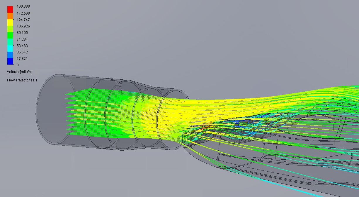 CFD simulation showing colored velocity flow trajectories around an object exiting a cylindrical duct, with speed indicated in miles per hour.