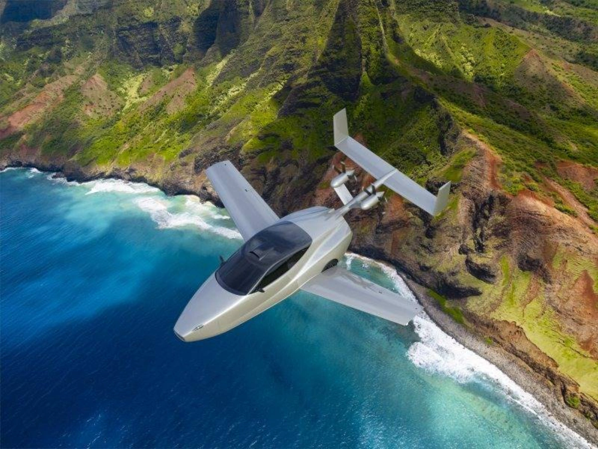 Electra.aero electric flying car flying over the Na Pali Coast of Kauai, Hawaii.